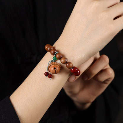 Purple Gold Cinnabar Sandalwood Beads Peach Wood Bell Bracelet